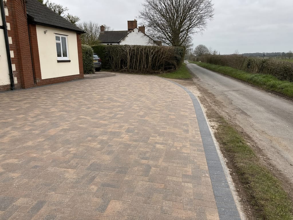 Brindle block driveway meeting a country lane at Balsall Common